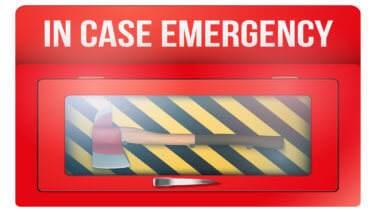 Fireaxe under glass labeled "IN CASE EMERGENCY"